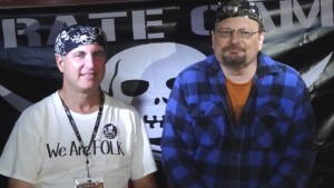 Michael Kornfeld (left) and Stuart Kabak (right) host late-night music under the AcousticMusicScene.com tent @ Pirate Camp (Photo: Bob Drake)